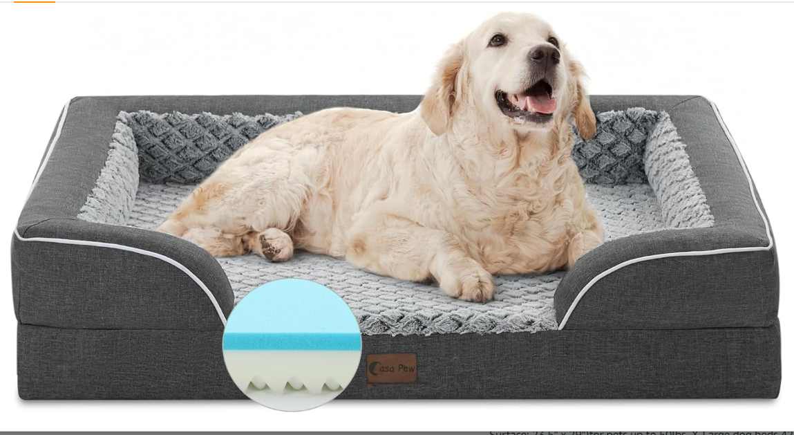 A dog bed with a dog on it